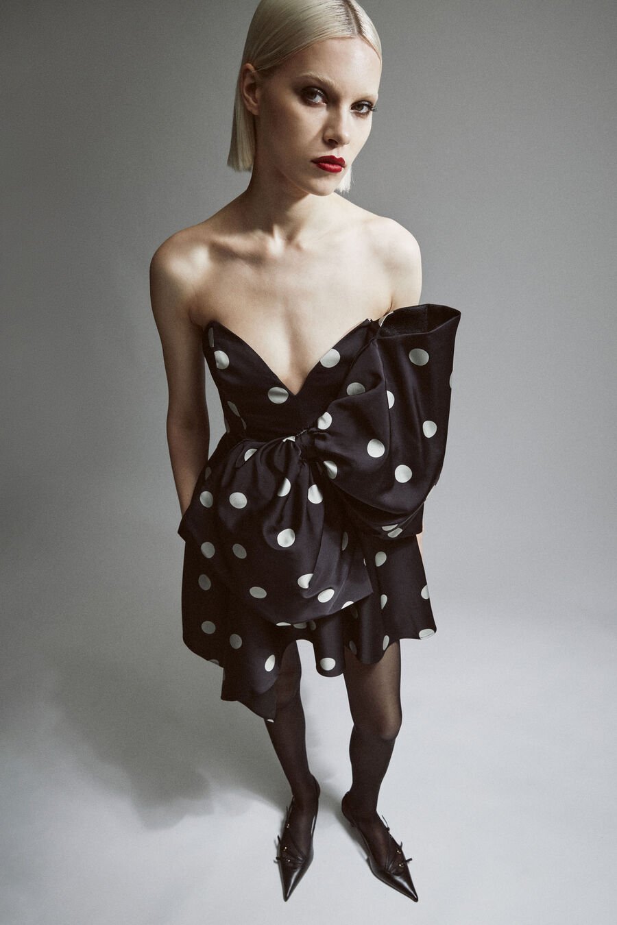 BRYDIE BOW MINI DRESS in colour BLACK SPOT
