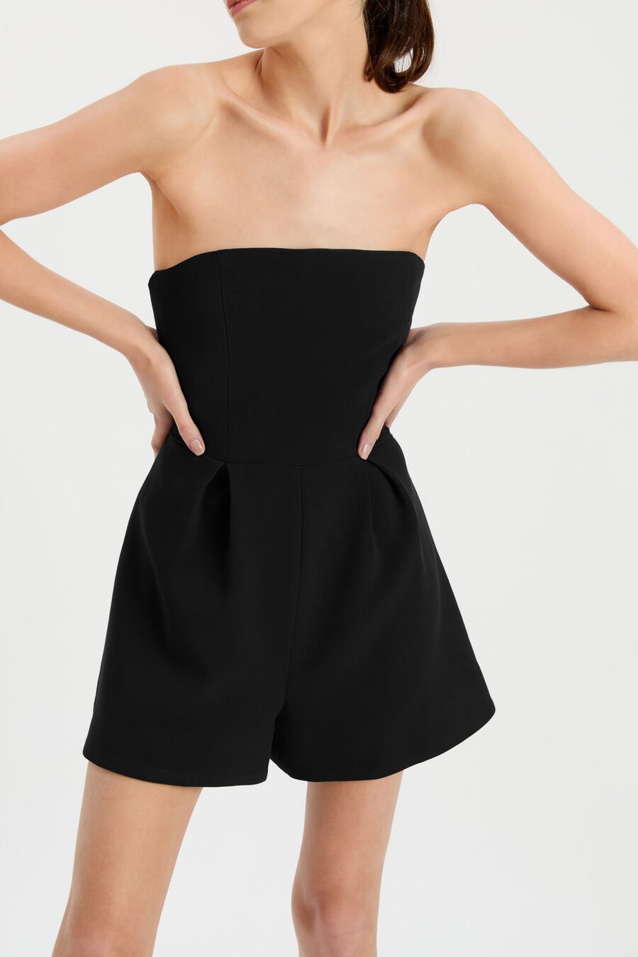 KAROLINE STRAPLESS PLAYSUIT in colour BLACK